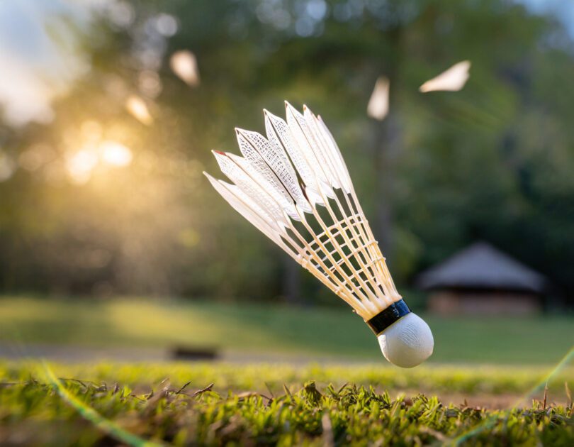 A Thumbnail Featuring A Close-Up Shot Of A Shuttlecock Mid-Air After A Powerful Smash, Conveying The Excitement Of Badminton Action.